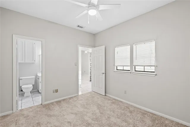 a view of an empty room with a bathroom