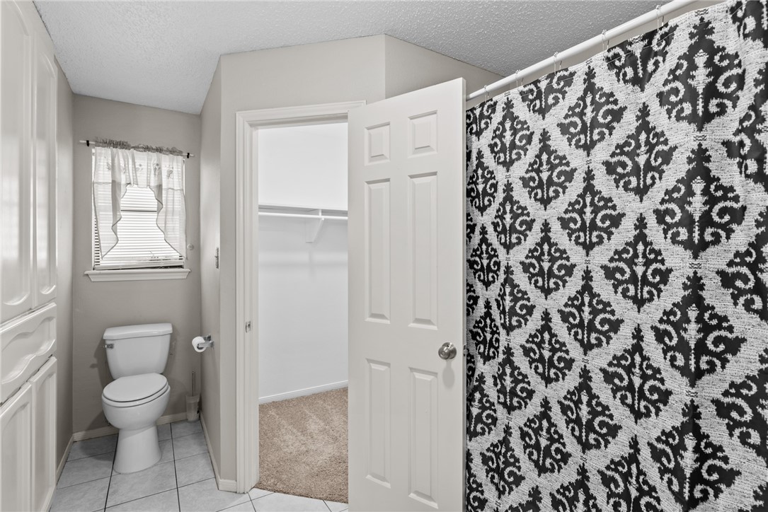 3025 Quail Springs Road, Unit B7 Corpus Christi, TX 78414 - Photo 17 of 23 a bathroom with a toilet and a shower