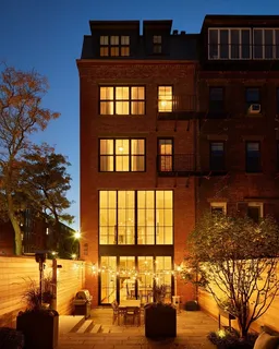 a front view of a building with outdoor space