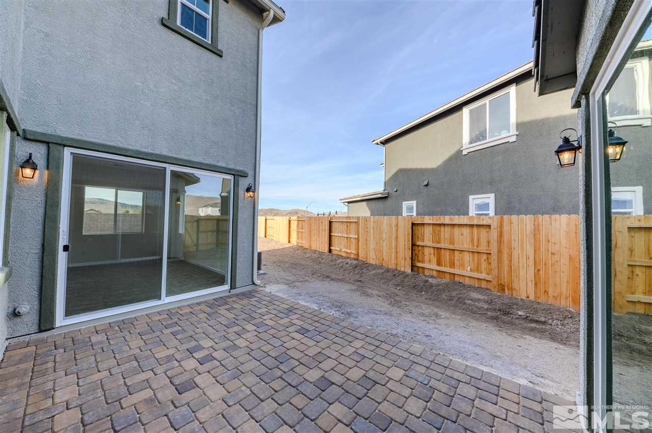 9257 Blue Basin Trail, Unit HOMESITE 16 Reno, NV 89521 - Photo 13 of 22 a view of a house with backyard and parking space