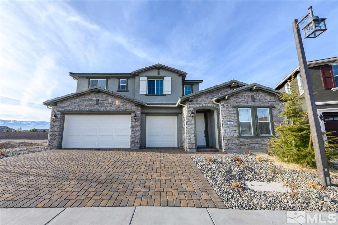 9257 Blue Basin Trail, Unit HOMESITE 16 Reno, NV 89521 - Photo 2 of 22 a front view of a house with a yard and garage
