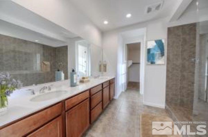 9257 Blue Basin Trail, Unit HOMESITE 16 Reno, NV 89521 - Photo 6 of 22 a bathroom with sink shower and mirror