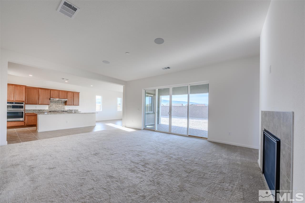 9257 Blue Basin Trail, Unit HOMESITE 16 Reno, NV 89521 - Photo 8 of 22 a view of empty room with a fireplace