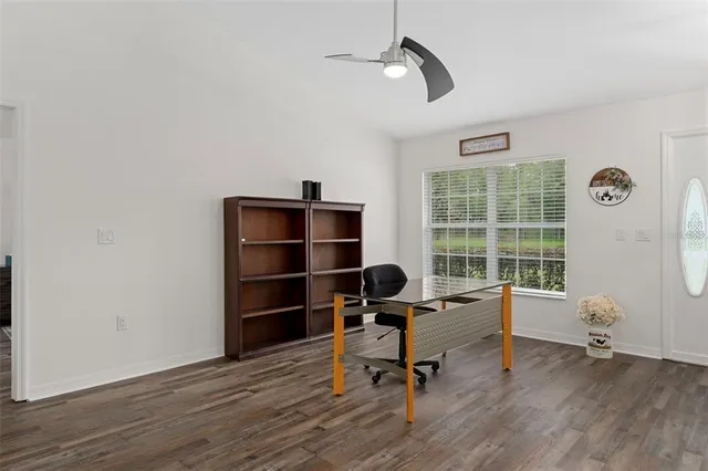 a view of a dining room with furniture wooden floor and chandelier