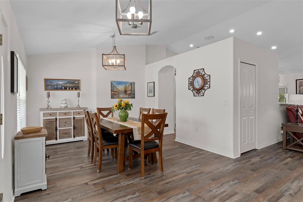 7 Bigleaf Court Homosassa, FL 34446 - Photo 15 of 71 a view of a dining room with furniture wooden floor and chandelier