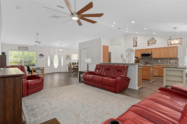 a kitchen with granite countertop a sink and a stove top oven
