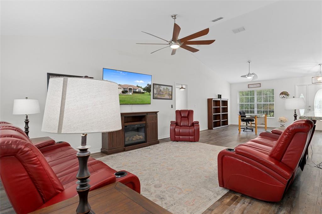 7 Bigleaf Court Homosassa, FL 34446 - Photo 18 of 71 a living room with furniture and a fireplace