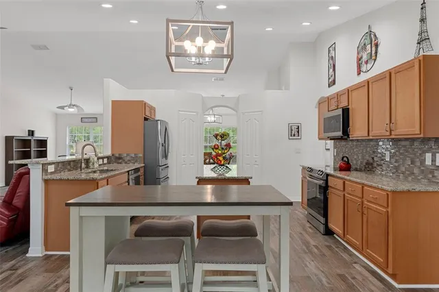 a view of livingroom with hardwood floor and hallway