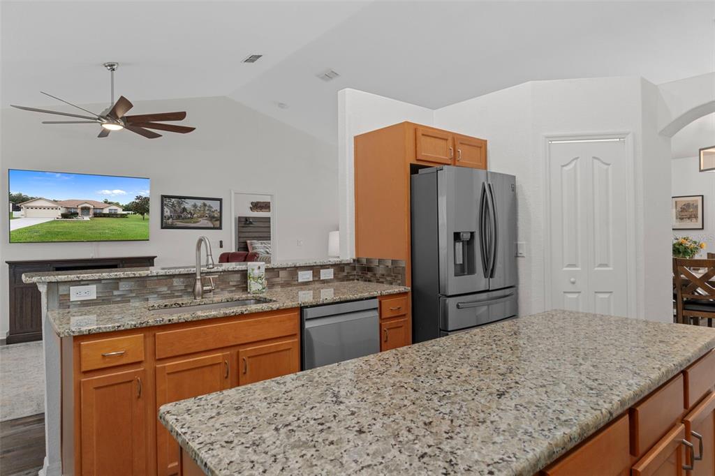 7 Bigleaf Court Homosassa, FL 34446 - Photo 23 of 71 a kitchen with stainless steel appliances granite countertop a sink refrigerator and cabinets
