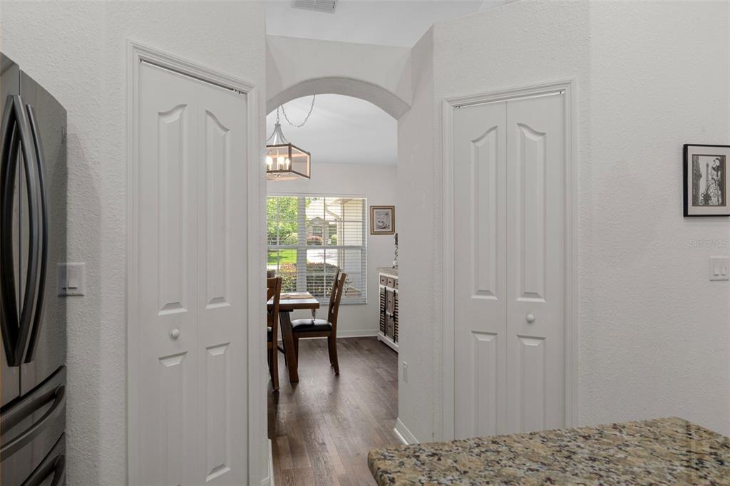 7 Bigleaf Court Homosassa, FL 34446 - Photo 27 of 71 a view of a hallway with wooden floor and a livingroom