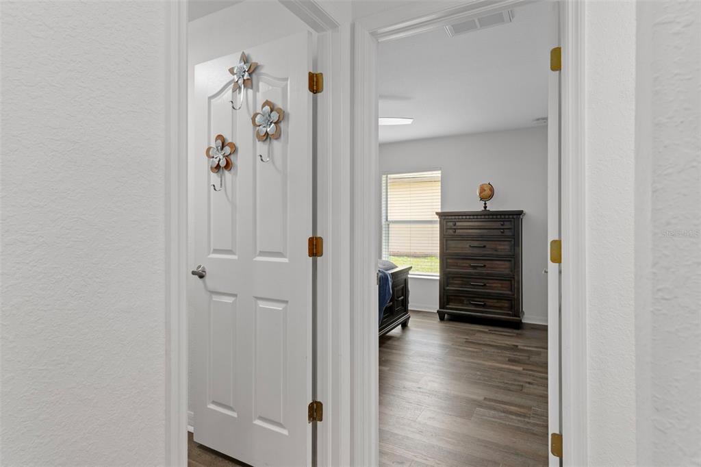 7 Bigleaf Court Homosassa, FL 34446 - Photo 39 of 71 a view of a hallway with wooden floor and closet