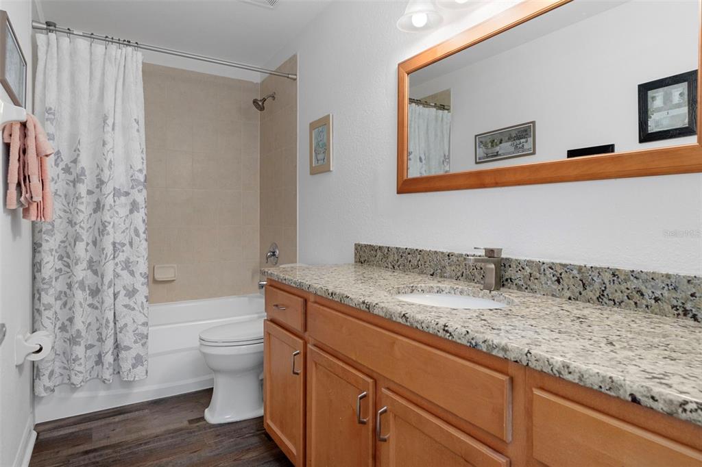 7 Bigleaf Court Homosassa, FL 34446 - Photo 43 of 71 a bathroom with a granite countertop sink toilet and shower
