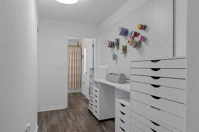 an aerial view of a residential houses with yard