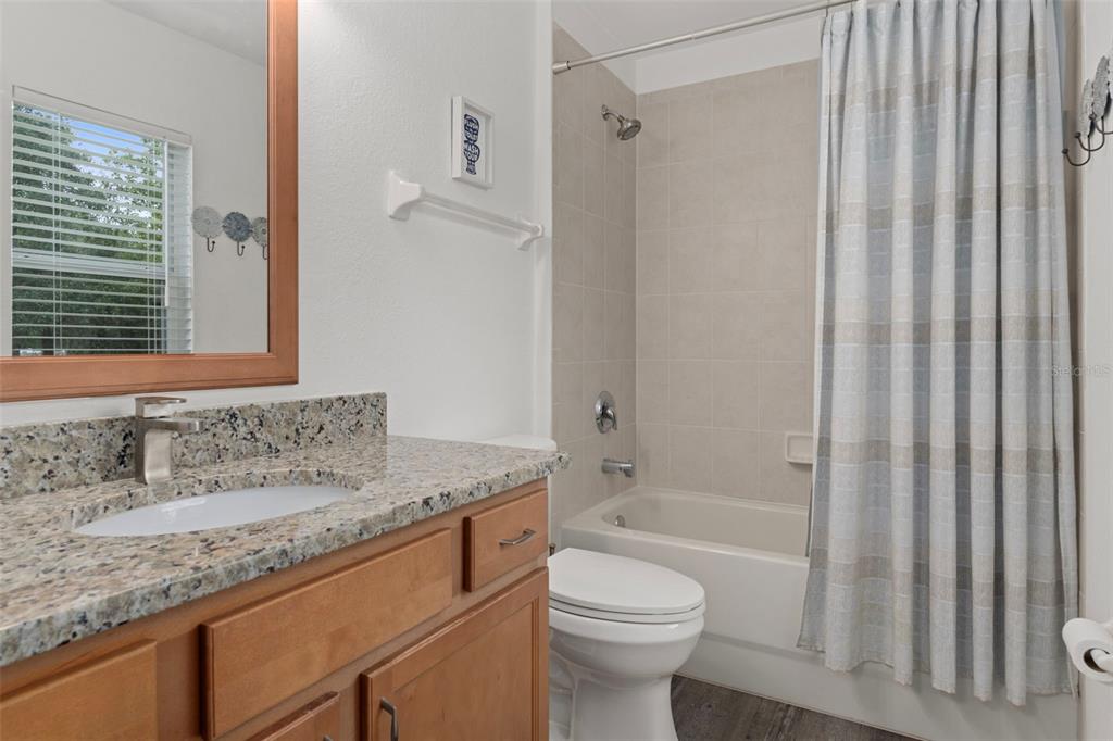 7 Bigleaf Court Homosassa, FL 34446 - Photo 48 of 71 a bathroom with a granite countertop sink toilet and shower