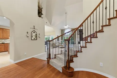 a view of an entryway with wooden floor