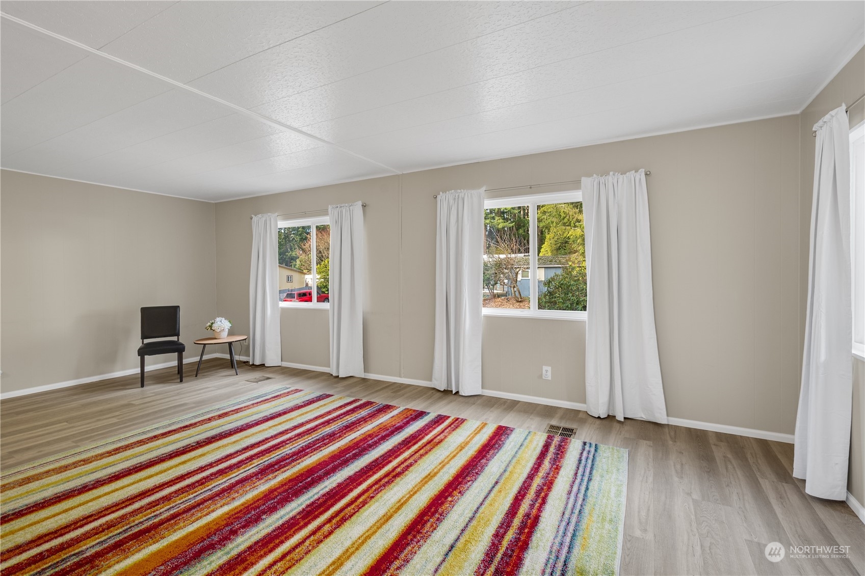 3312 206th Place Southeast Bothell, WA 98012 - Photo 3 of 25 a bedroom with a bed and a window