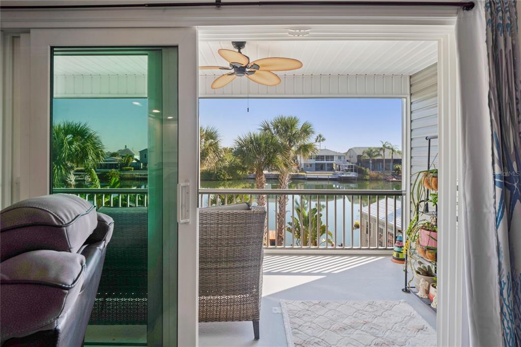 3270 Hibiscus Drive Hernando Beach, FL 34607 - Photo 11 of 75 a balcony with furniture and a potted plant