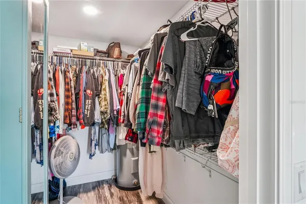 a view of a balcony with wooden floor and fence