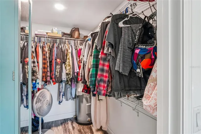 a view of a balcony with wooden floor and fence