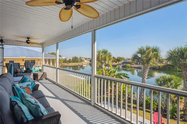 an aerial view of residential houses with outdoor space and swimming pool