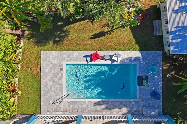 an aerial view of a house with a lake view
