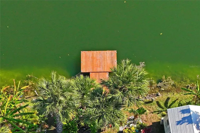an aerial view of residential building and ocean
