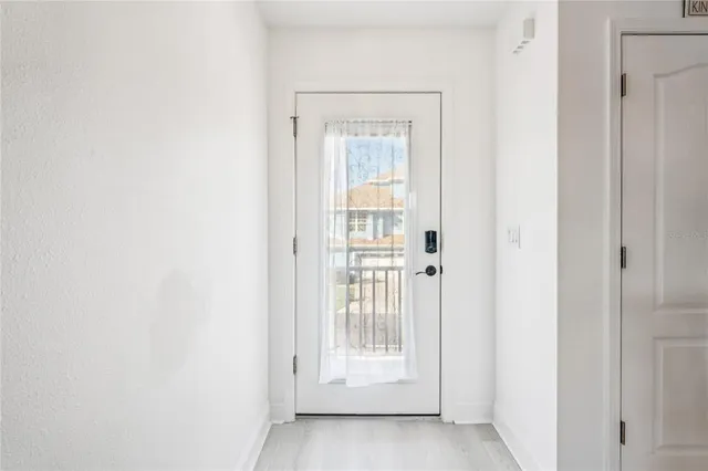 a living room with furniture kitchen view and a dining table