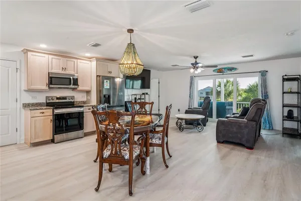 a balcony with furniture and a potted plant