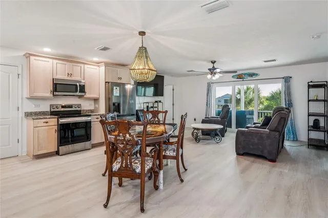 a balcony with furniture and a potted plant