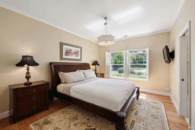 a en suite bathroom with a granite countertop sink mirror and a shower