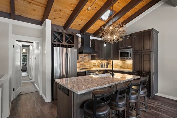 a kitchen with a table and chairs in it