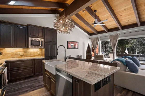 a kitchen with stainless steel appliances granite countertop a sink and cabinets