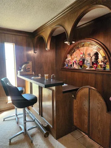 a view of a hallway with seating area