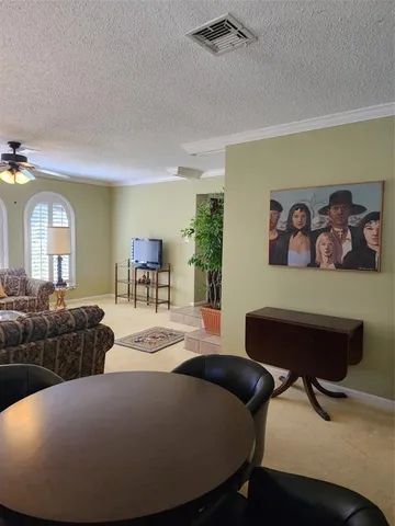 a bed room with furniture and a chandelier