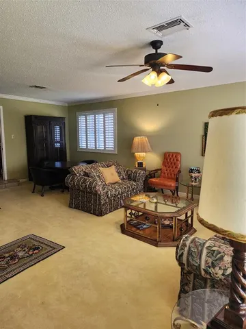 a kitchen with a cabinets and chairs