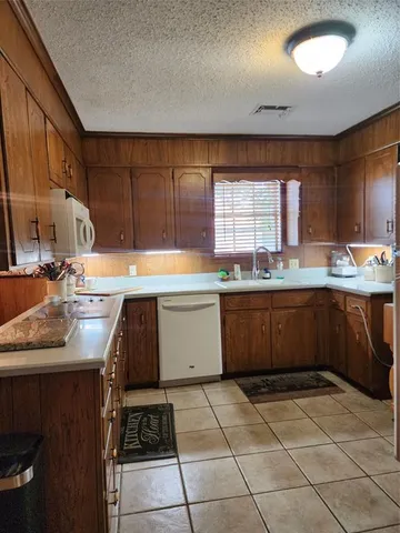 a living room with furniture gym equipment and a fireplace