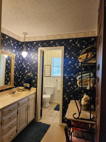 a living room with furniture a air conditioner and a window