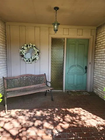 a view of a porch with a bench