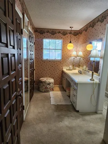 a view of a living room and bathroom