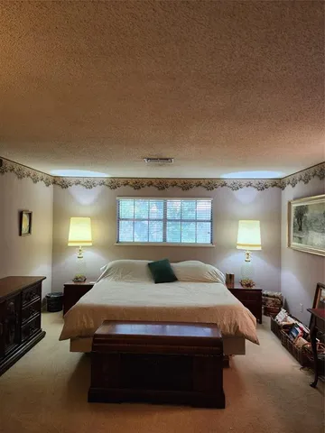 a bathroom with a sink and mirror with toilet