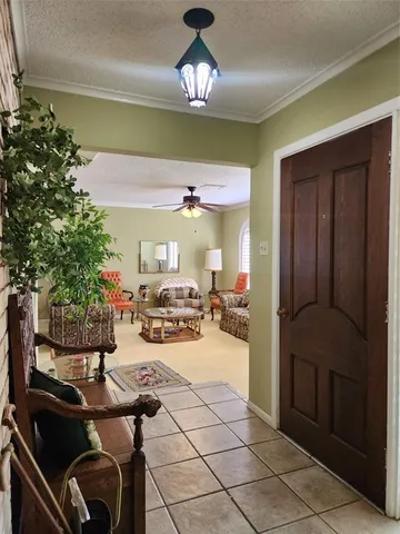 a kitchen with a table chairs and a refrigerator