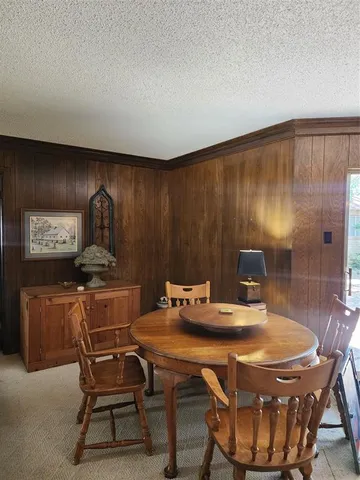 a living room with furniture and a lamp