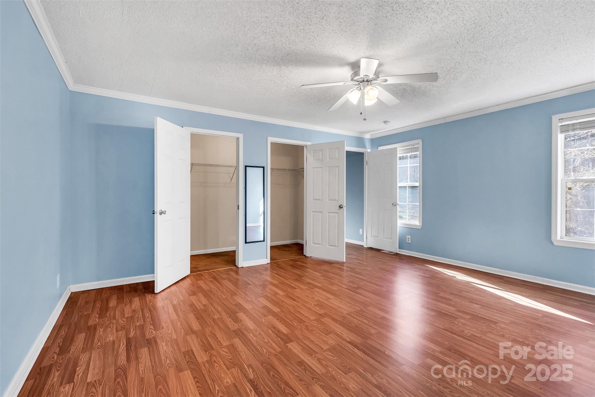 530 Ole Simpson Place Catawba, SC 29704 - Photo 15 of 36 an empty room with wooden floor fan and windows