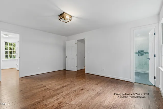 a kitchen with granite countertop a sink cabinets and stainless steel appliances