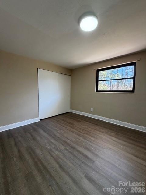 904 8th Avenue Southwest Conover, NC 28613 - Photo 4 of 8 a view of an empty room with wooden floor and a window
