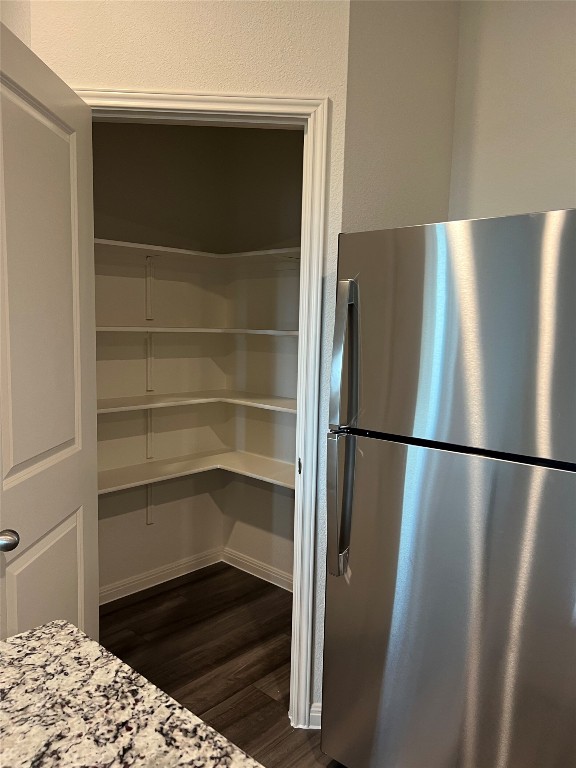 124 Rother Place Taylor, TX 76574 - Photo 8 of 24 a refrigerator freezer sitting in a kitchen