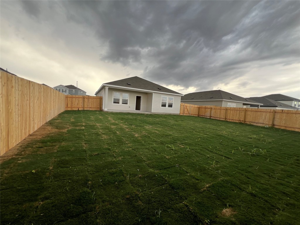 124 Rother Place Taylor, TX 76574 - Photo 19 of 24 a view of a big house with a big yard and large trees