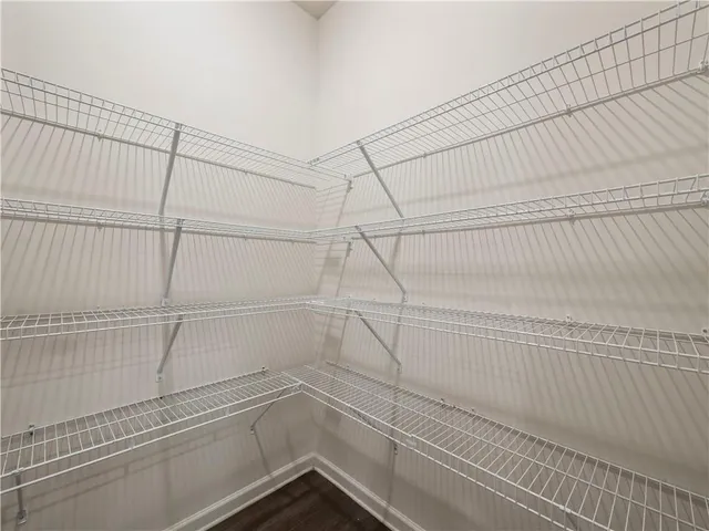 a view of a room with racks on the wall