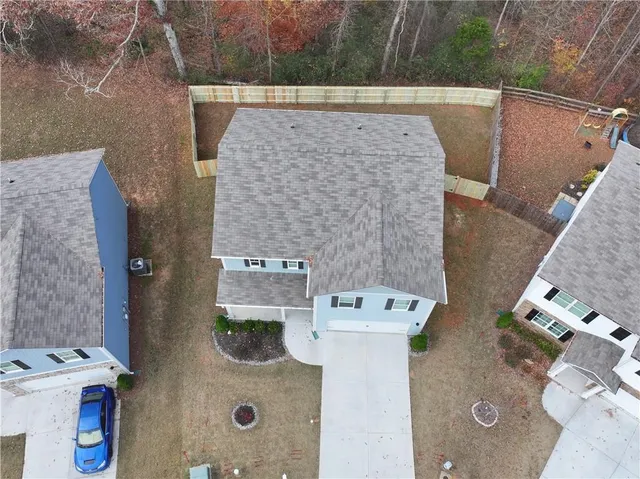 aerial view of a fireplace with washer and a lake view