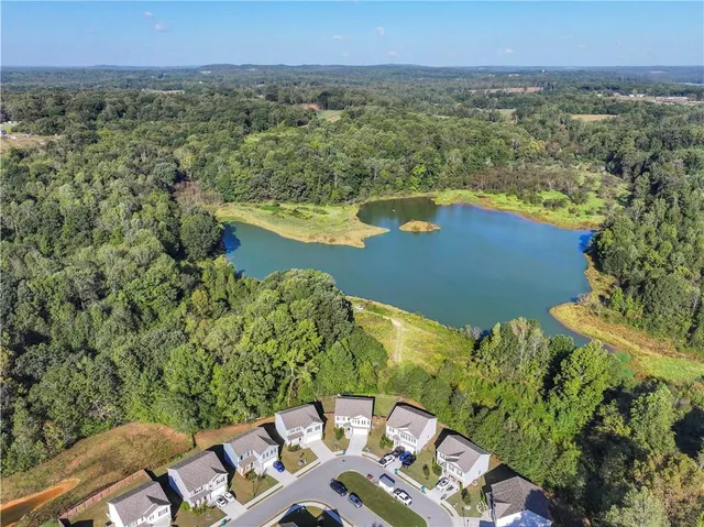 a view of lake with green space